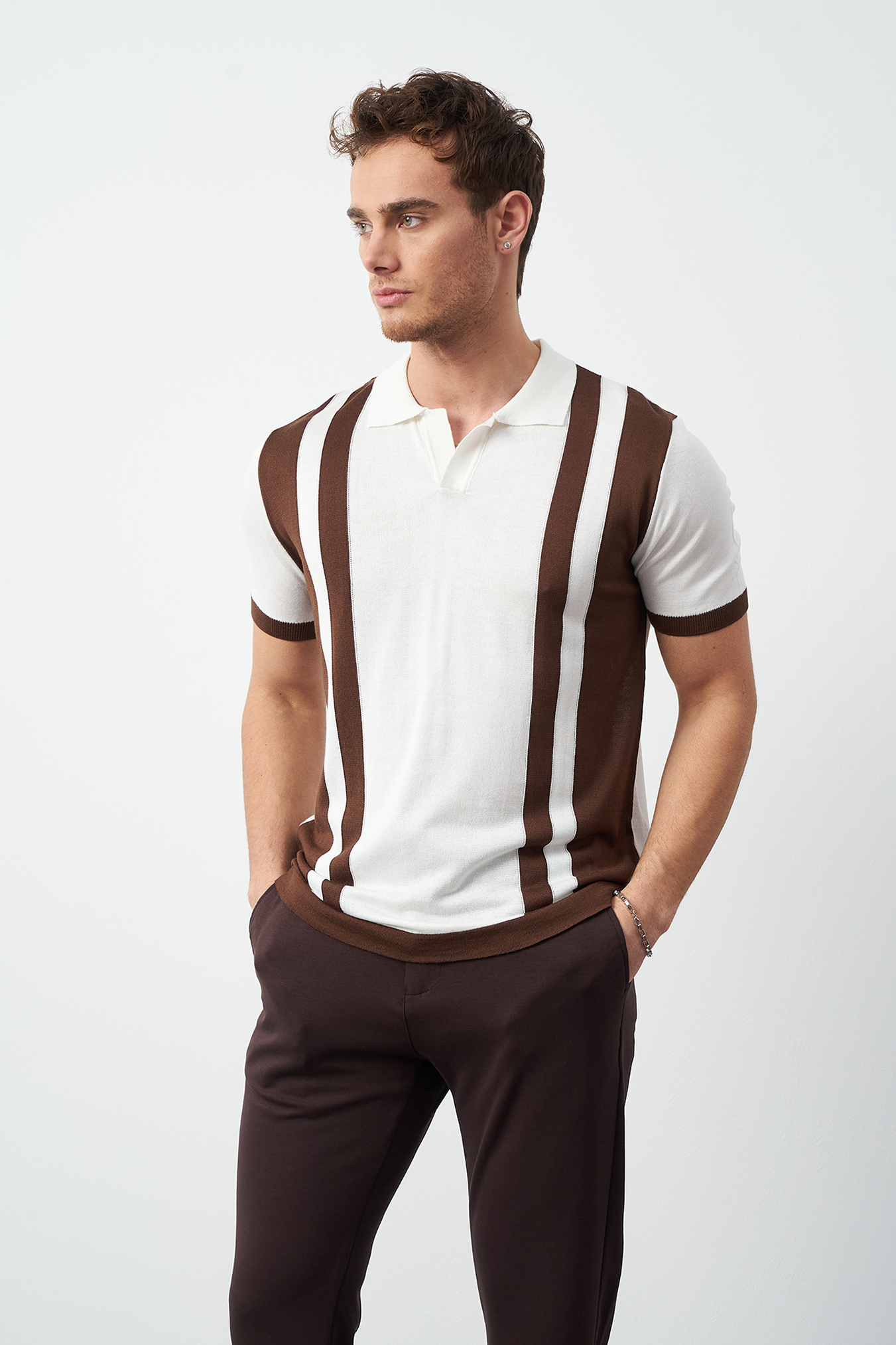 Oversized polo shirt side view on model - Brown striped relaxed fit by Mesfeno Wear