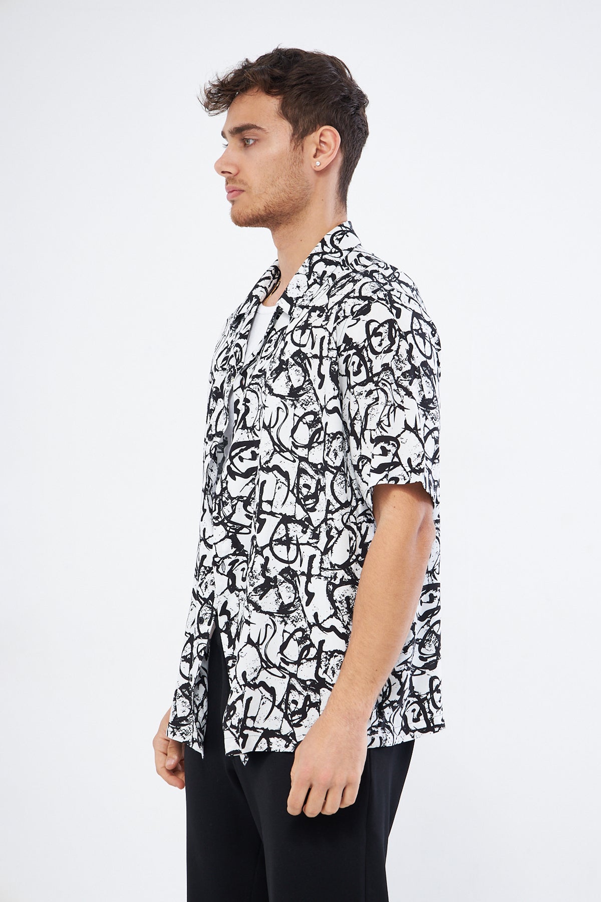 Side view black white casual button down shirt, oversized Cuban collar modern printed design men